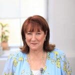 Headshot of a woman in her office